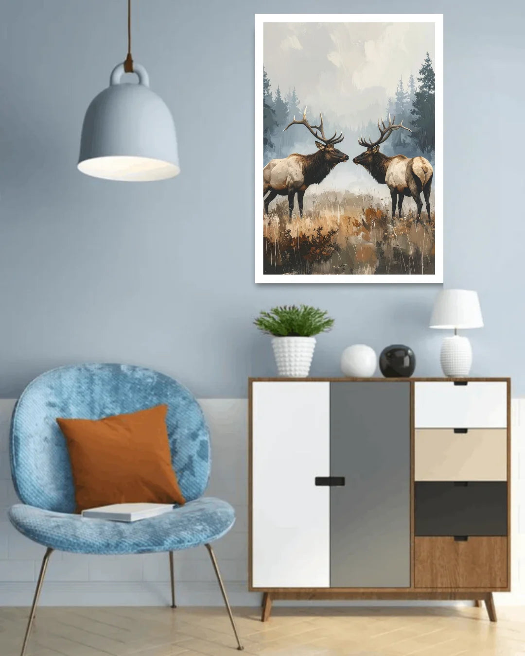 Modern living room with a blue armchair, wooden cabinet, and framed artwork of two elk.