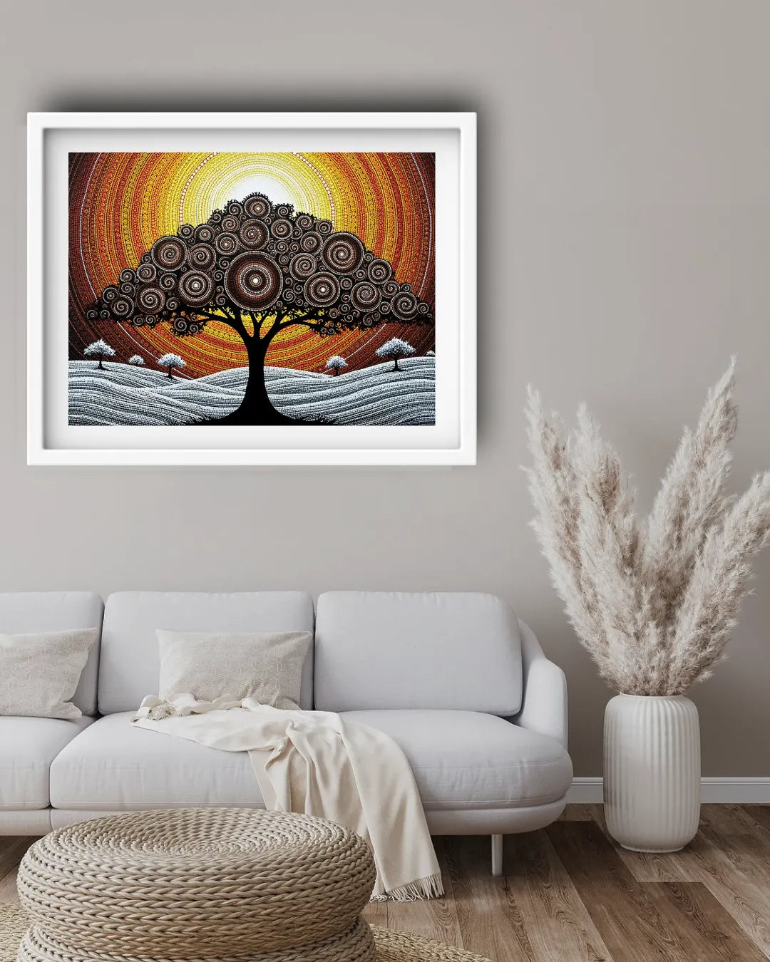 Framed artwork of a tree with a colorful background in a living room setting.