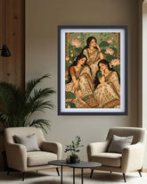A framed art print depicting three women in traditional Indian sarees, hung on a beige wall in a modern living room setting with two beige armchairs and a small round coffee table.