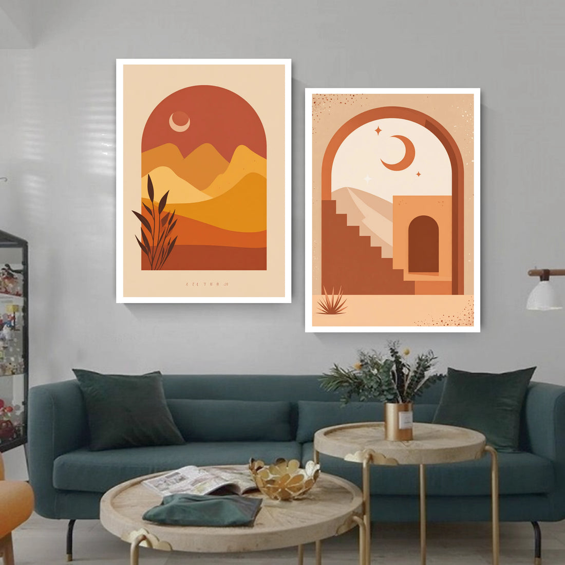 Two abstract landscape artworks on a wall above a teal sofa in a living room.