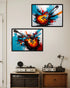Two framed artworks of guitars on a wall above vintage record players.
