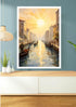 A framed art print depicting a Venice canal scene at sunset, displayed on a blue wall above a light wood console table with decorative vases and a hanging lamp.