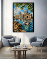 A framed vertical canvas print of a vibrant city harbor scene with boats, historic architecture, and lush green foliage, displayed on a light gray wall in a modern living room setting with two gray armchairs and a wooden coffee table.
