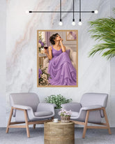 A framed art print depicting a woman in a flowing lavender gown sitting in a chair and holding a glass of red wine, displayed on a light marble wall above two modern gray armchairs with a small wooden side table in between.