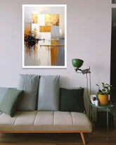 Living room with a beige sofa, decorative pillows, and a framed abstract painting on the wall.