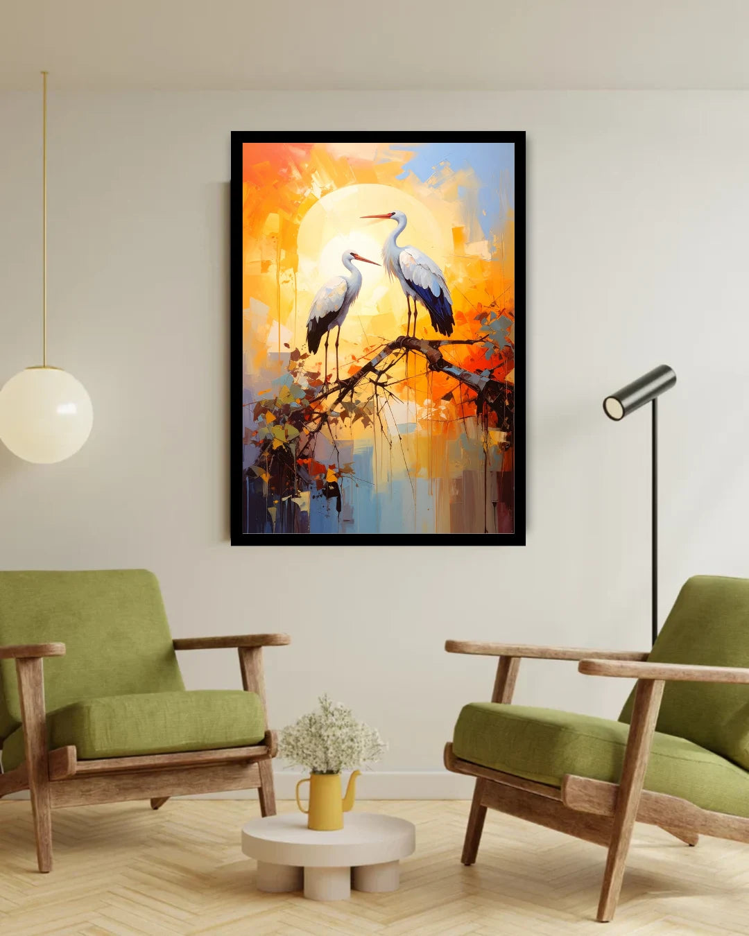 Framed abstract artwork of two cranes on a branch with a sunset background in a living room.