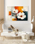 Abstract white floral wall art canvas displayed above a white sofa in a modern living room
