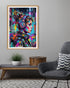 Colorful abstract art print of a woman with headphones on a gray wall above a coffee table.