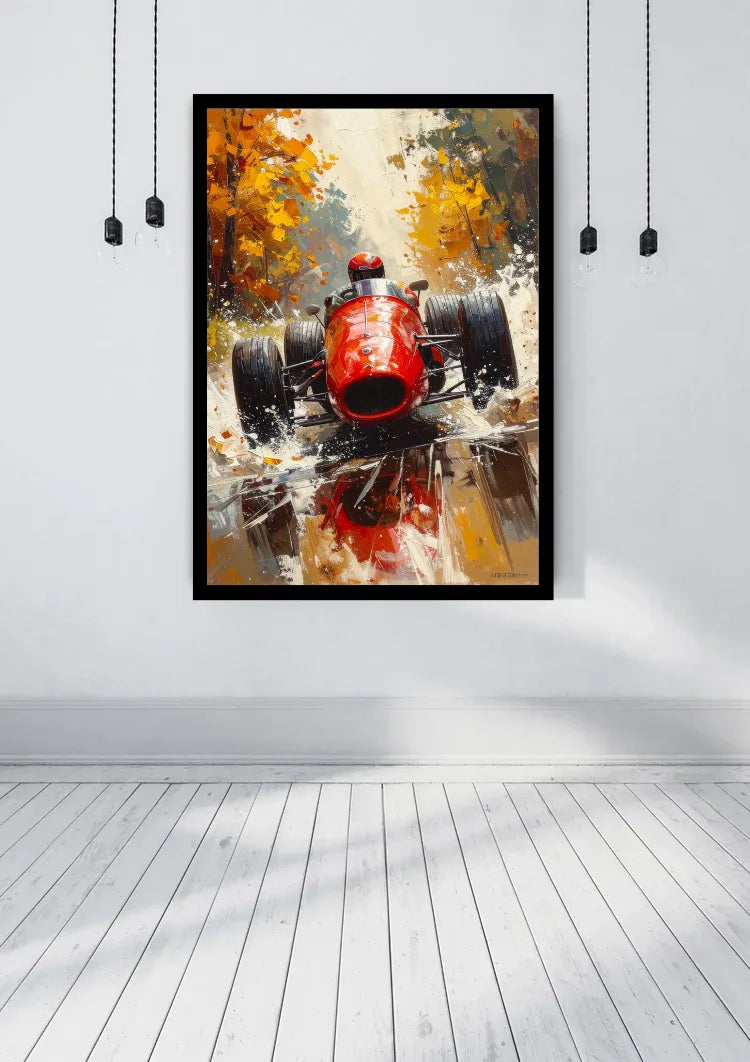 A framed abstract art print of a red race car hanging on a white wall in a modern room with a light wood floor.