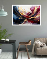 Abstract wall art print featuring swirling blue, burgundy, gold, and cream paint strokes, displayed in a white frame on a gray wall above a modern living room setup with a sofa, table, and plant.