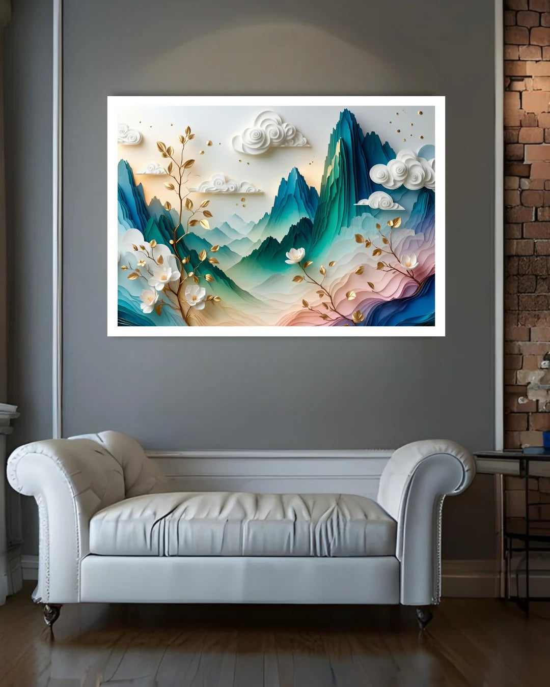 A framed wall art print featuring a stylized 3D mountain landscape with teal, blue, pink, and cream tones, displayed above a white leather sofa in a modern room with a gray wall and wood floor.