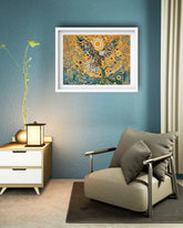 Decorative peacock painting on a blue wall above a modern armchair and side table.