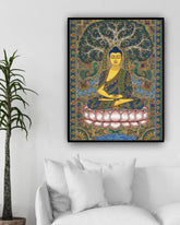 Framed artwork of Buddha sitting on a lotus flower with decorative elements, placed above a bed.