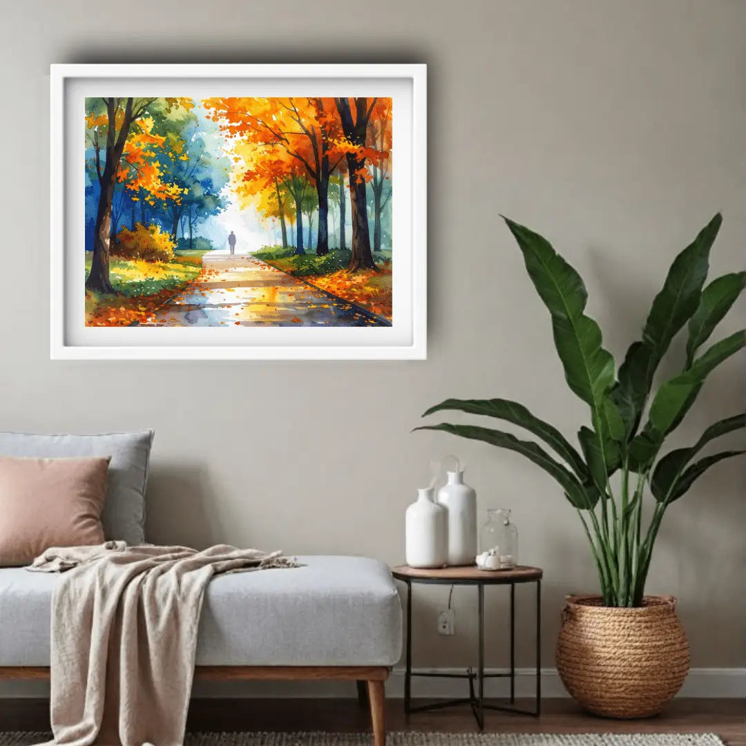 Framed painting of a autumnal landscape on a wall above a sofa.