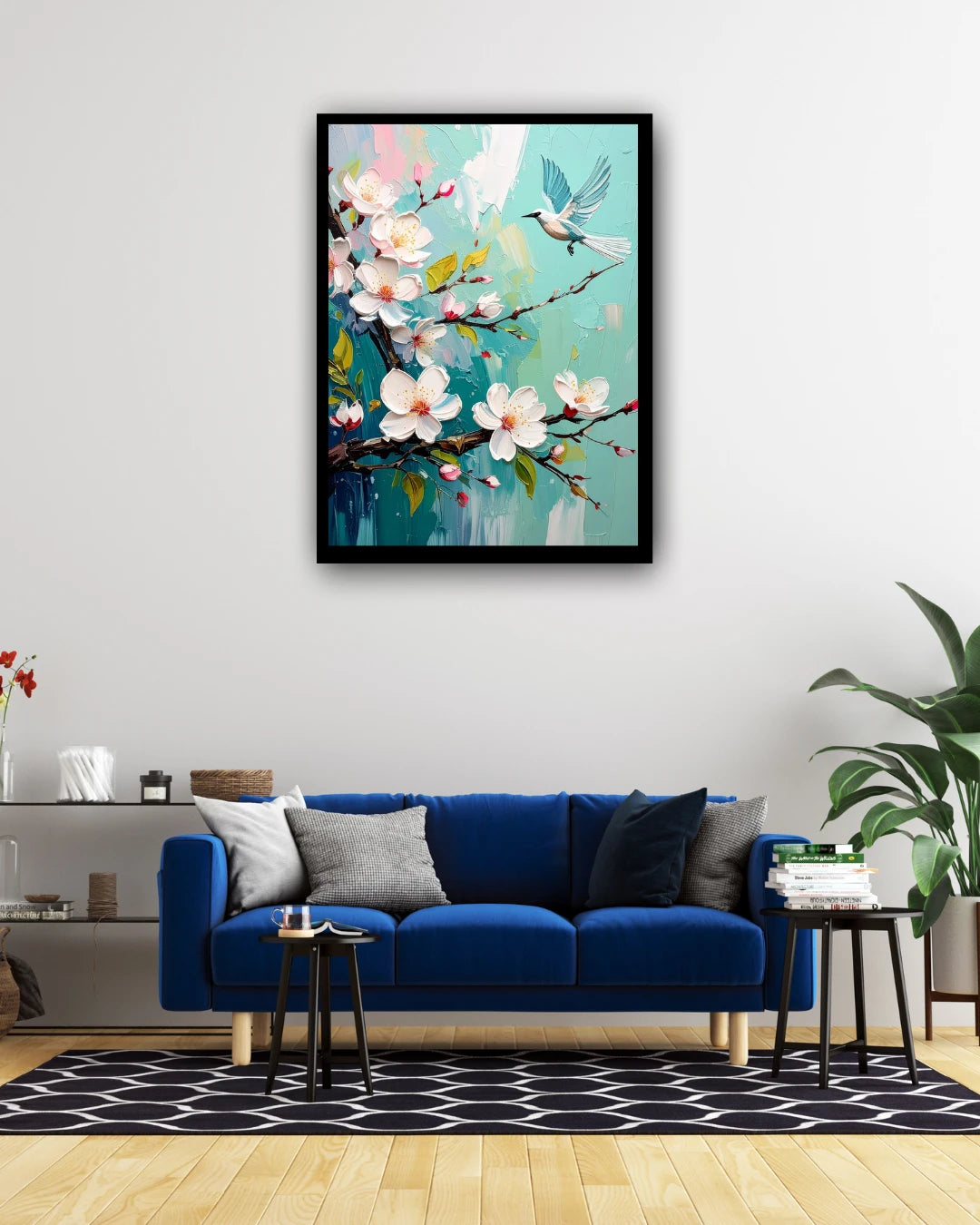 Bird and blossom floral wall art canvas displayed above a blue sofa in a modern living room
