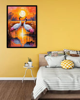 Framed artwork of cranes on a yellow wall above a bed with striped bedding.