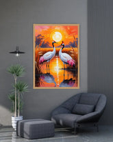 Framed artwork of two cranes in a sunset setting on a gray wall above a modern chair.