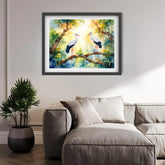 Framed painting of two birds on a branch above a living room with a sofa and plant.