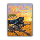 Premium wildlife canvas artwork featuring a majestic black panther resting on rocky terrain beneath a vibrant sunset sky.