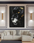 A framed black panther wall art print with glowing amber eyes and gold accents, displayed in a modern living room setting above a light beige sectional sofa.