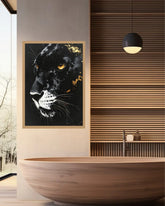 A framed wall art print featuring a black panther portrait with gold and white details, displayed in a modern bathroom setting above a wooden bathtub.