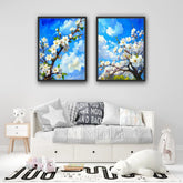 Blue blossom floral wall art canvas set displayed in a bright modern living room
