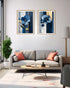 minimal blue floral painting displayed above sofa in cozy home setup
