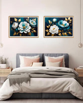 blue and white floral painting with gold accents above bed