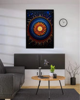 A framed square wall art print featuring a colorful mandala-style sun design hangs on a white wall above a modern gray cabinet in a styled living room setting.