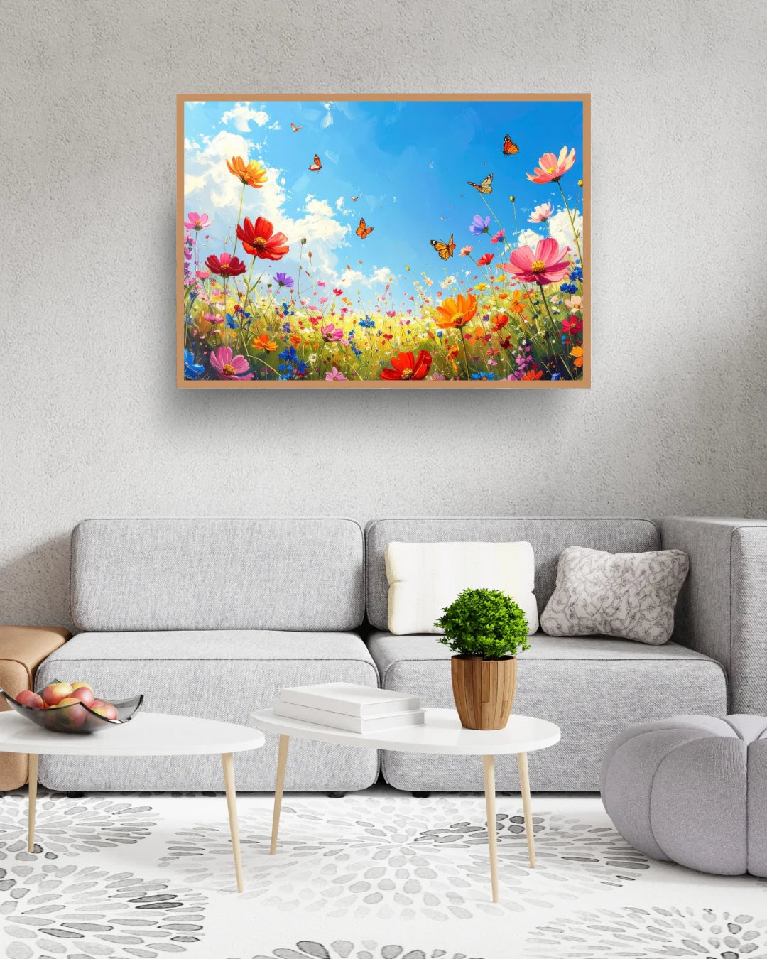 Colorful butterfly flower wall art canvas displayed above a grey sofa in a modern living room
