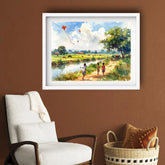 Framed painting of children flying kites by a river on a brown wall above a white armchair.