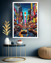 Framed artwork of a vibrant city street scene with neon lights and taxis, displayed on a wall.