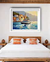 A framed coastal painting hangs above a bed in a bedroom. The artwork shows a white ferry on blue water with colorful buildings and mountains in the background.