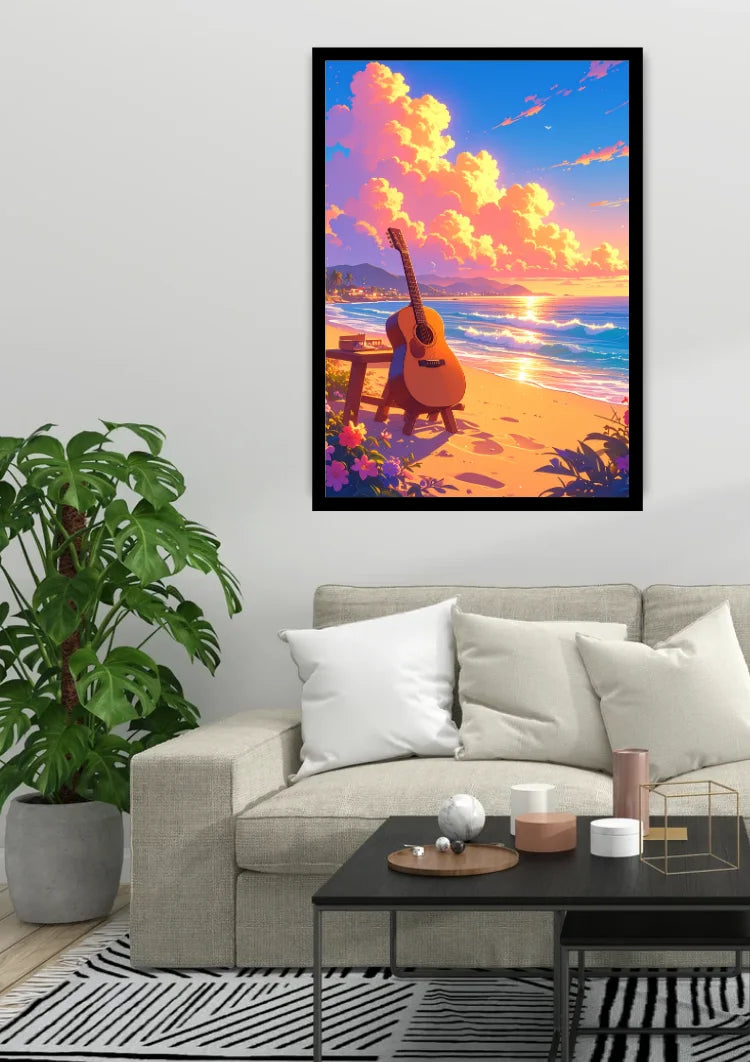 A framed vertical art print depicting a colorful beach sunset with an acoustic guitar on the sand, displayed on a light gray wall above a beige sofa in a modern living room setting.