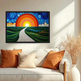 A framed colorful landscape painting hangs on a beige wall above a white sofa with orange and cream pillows. The artwork shows a winding road leading to a large orange and red sun over green rolling hills under a blue swirling sky.