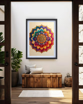 A framed colorful mandala art print hangs on a white wall above a wooden bench with pillows in a modern entryway setting.