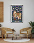 cow and calf wall art displayed above chairs in modern living room