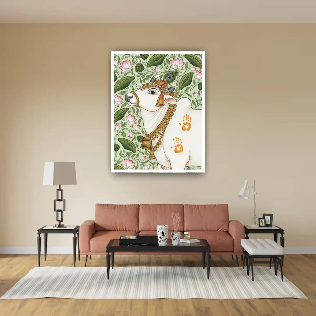 Living room with a pink sofa, coffee table, and decorative wall art featuring a cow and floral design.