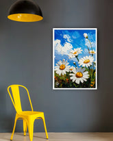 Daisy floral wall art canvas hanging on a grey wall with a yellow chair
