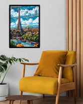 Yellow armchair in a room with a framed artwork of Paris on the wall.