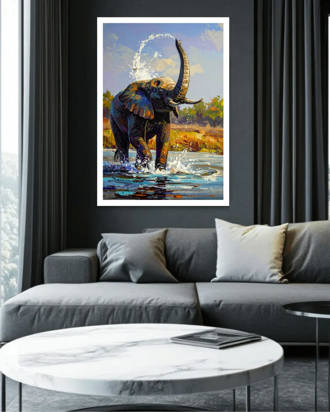 Framed painting of an elephant in a natural setting above a gray sofa in a living room.