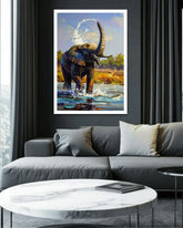 Framed painting of an elephant in a natural setting above a gray sofa in a living room.