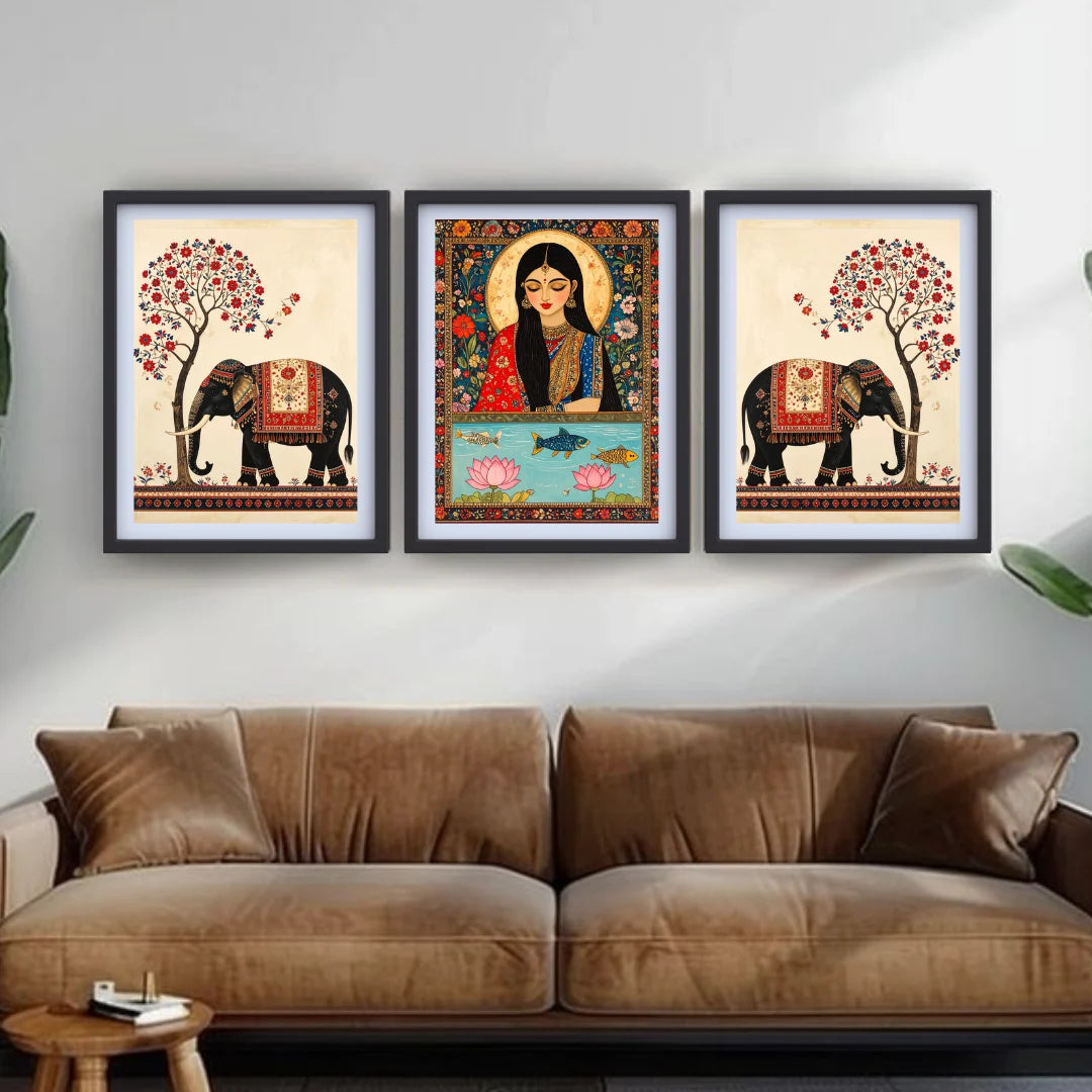 Three framed artworks above a brown sofa in a living room setting.