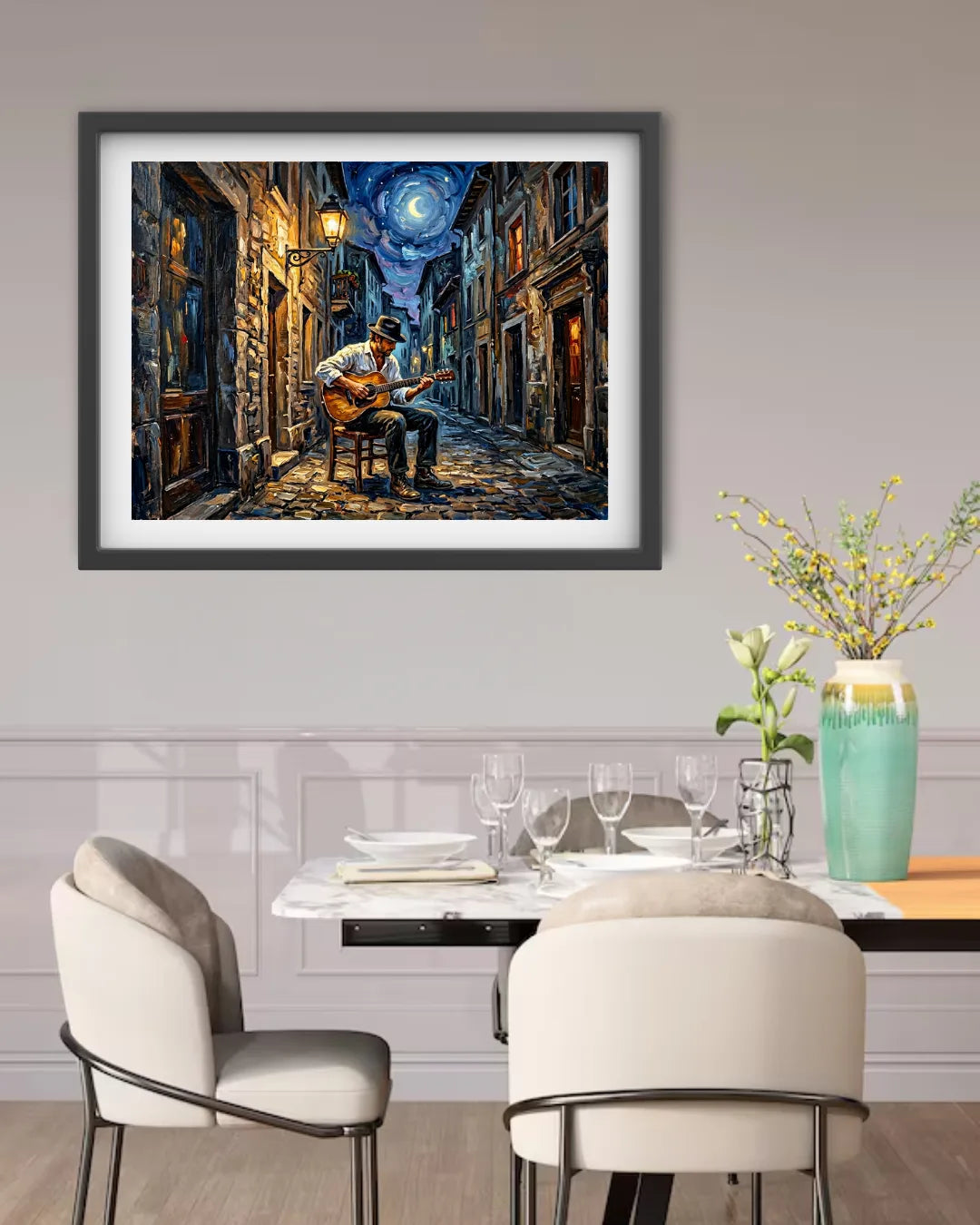 Framed painting of a musician playing guitar on a street at night above a dining table.