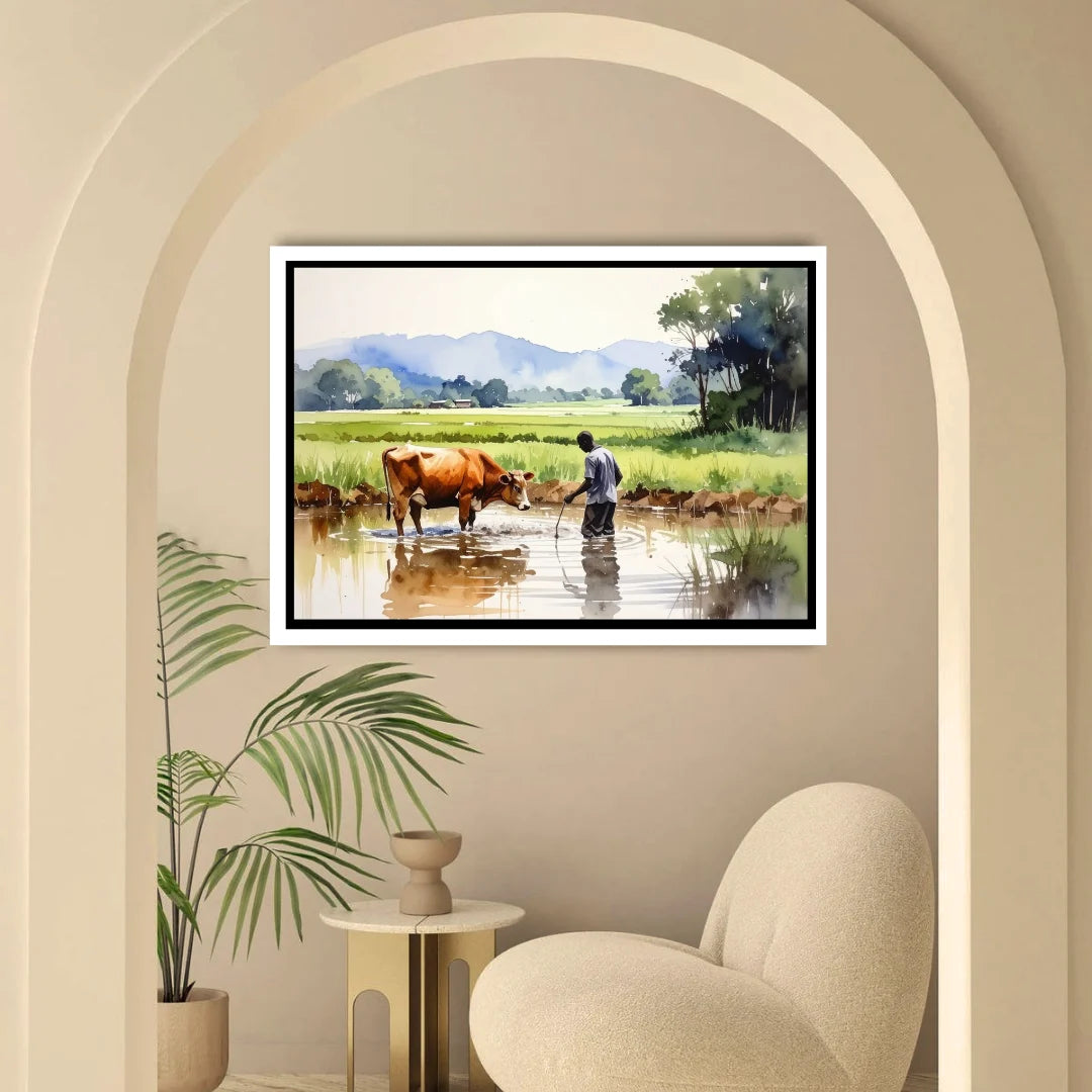 Framed painting of a man with a cow by a river on a wall in a room with a chair and plant.