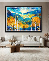 Colorful abstract forest painting on a wall above a sofa in a living room.