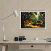 Desk setup with a lamp, camera, and keyboard, featuring a framed landscape painting on the wall.