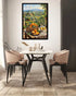 A framed vertical canvas print of a Tuscan landscape and fruit still life hangs on a white wall above a dining table with four chairs in a modern dining room setting.