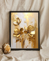 Gold floral wall art canvas displayed close up in a soft neutral interior

