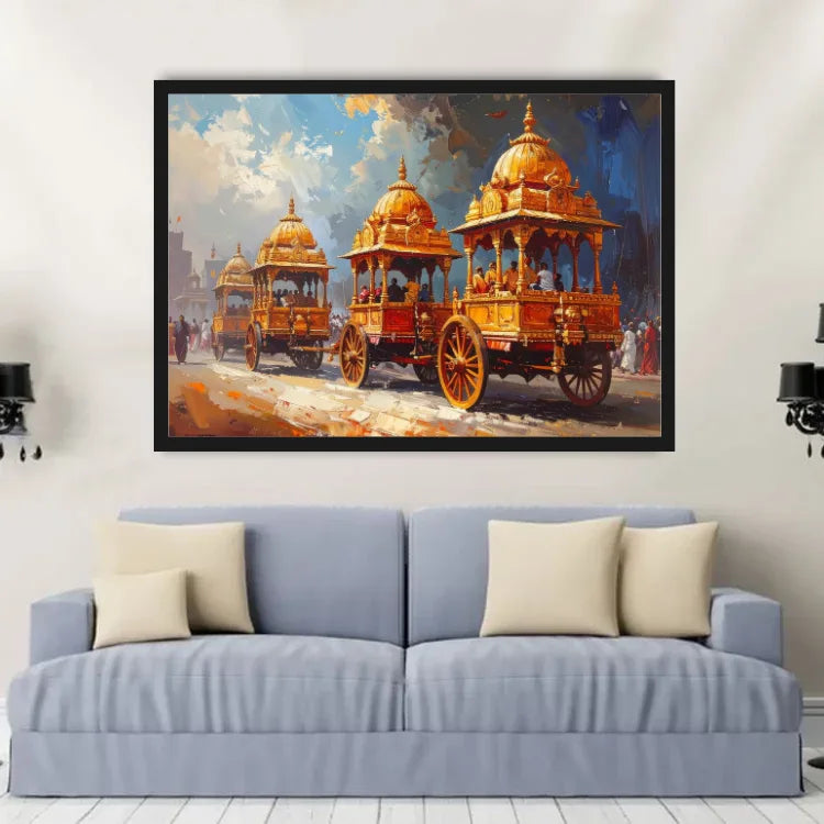 A framed painting of ornate golden chariots under a blue sky, displayed on a light gray wall above a blue sofa with cream pillows.